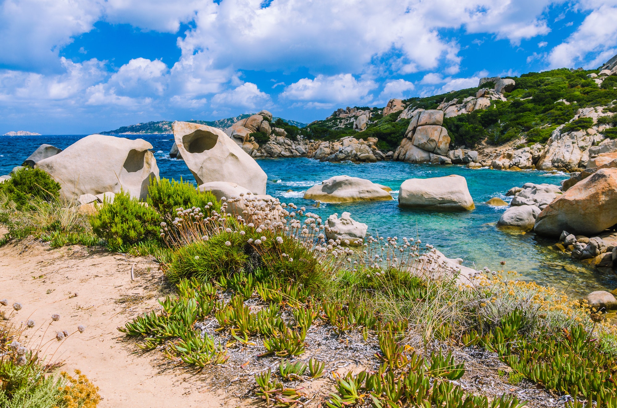 Cala Scilla place near Costa Serena with sandstone rocks in sea, Sardinia, Italy