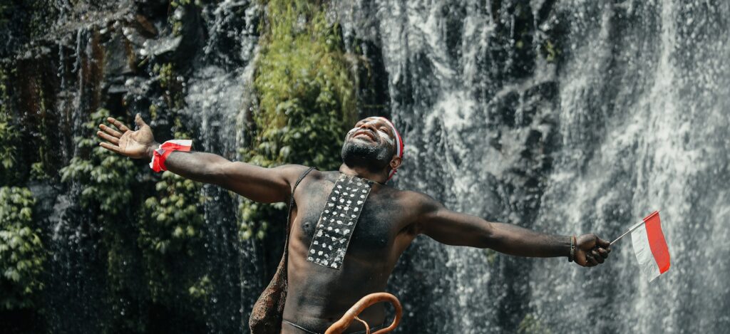 Black man from Papua tribe celebrating Indonesian Independence day