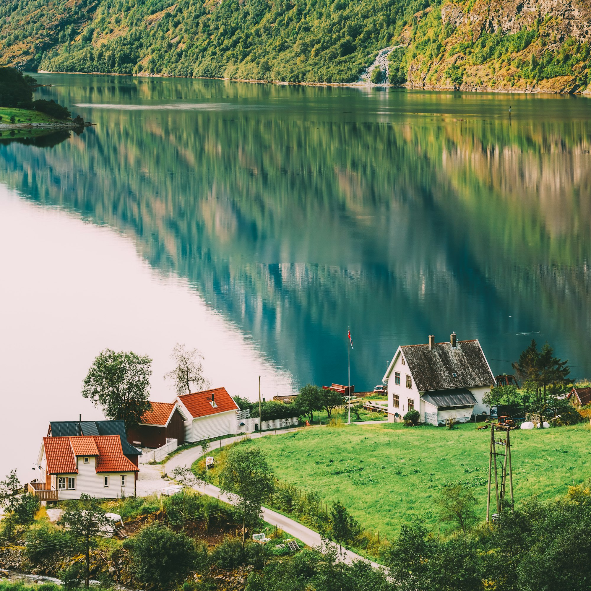 Scandinavian houses on shore of the narrowest fjord in Norway -