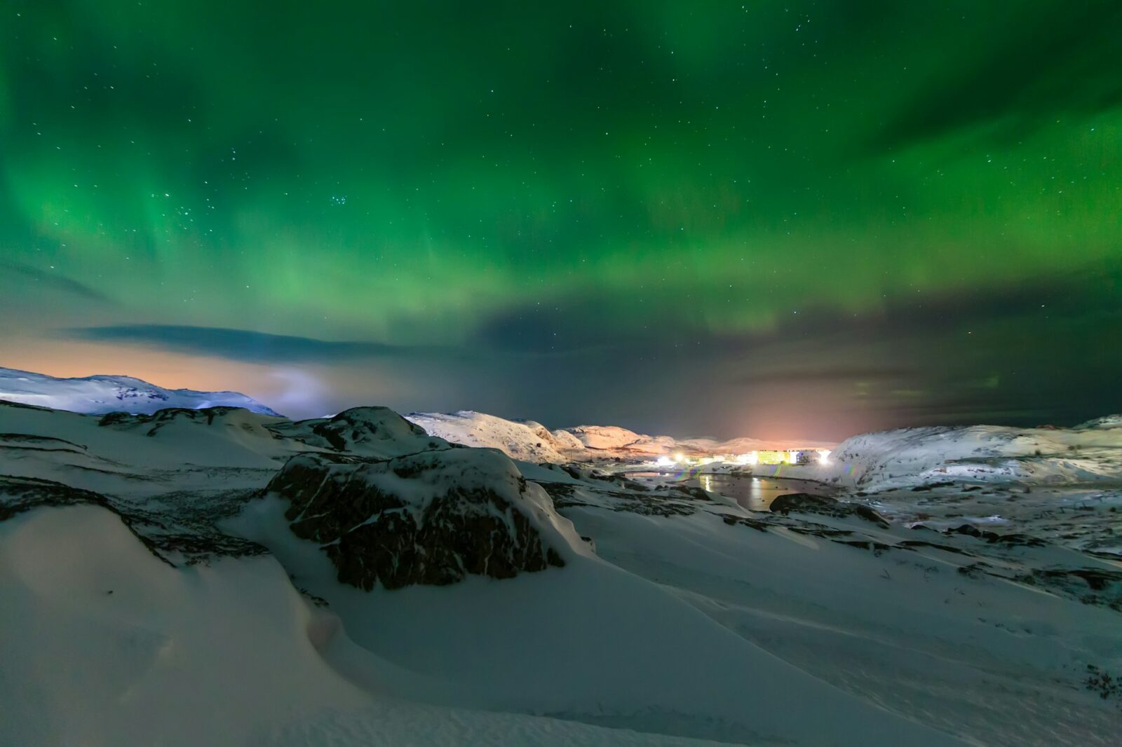 Northern lights above the fjord in Norway