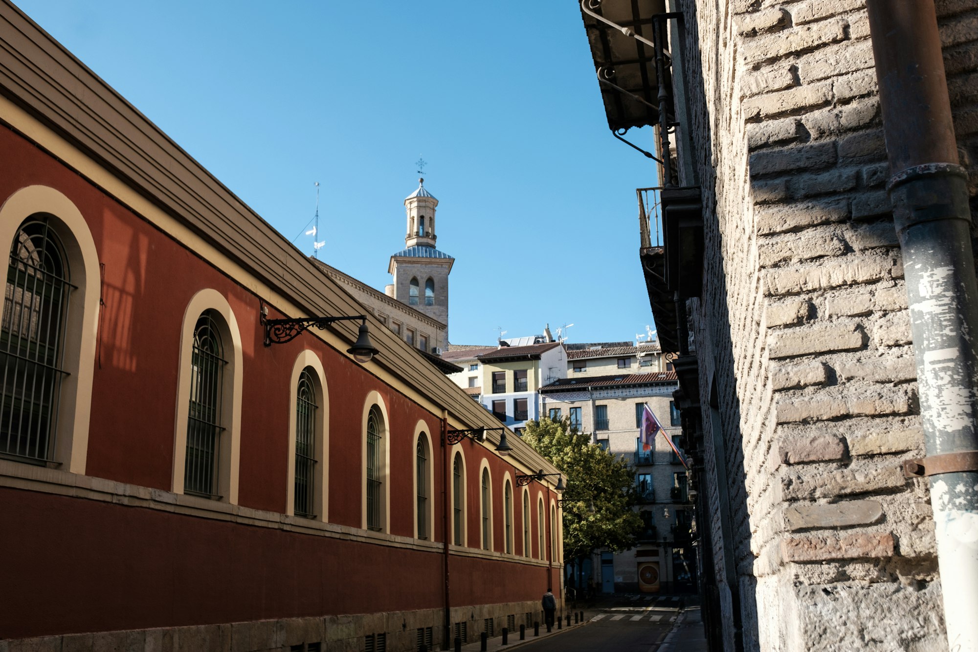 Red narrow street in old city in Spain.