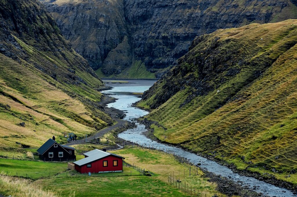 Autumn in small village Saksun. Black sandy beach out of focus. Streymoy, Faroe Islands. Europe