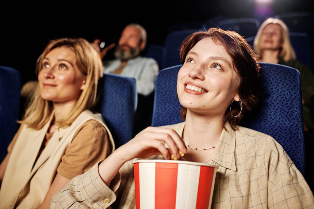 Joyful Young Woman At Cinema